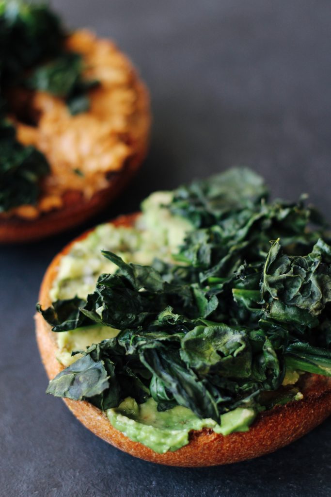 Crispy Kale Sandwiches. An easy, #vegan and #vegetarian breakfast idea: layer crispy kale on top of salted avocado and peanut butter. 